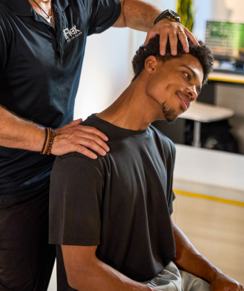 Man getting assisted stretched
