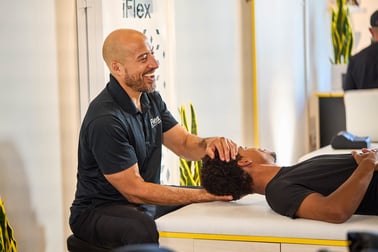 man getting a neck stretch at iFlex